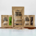3 Forth & Further compostable coffee packages with visible freeze-dried ingredients on a white background