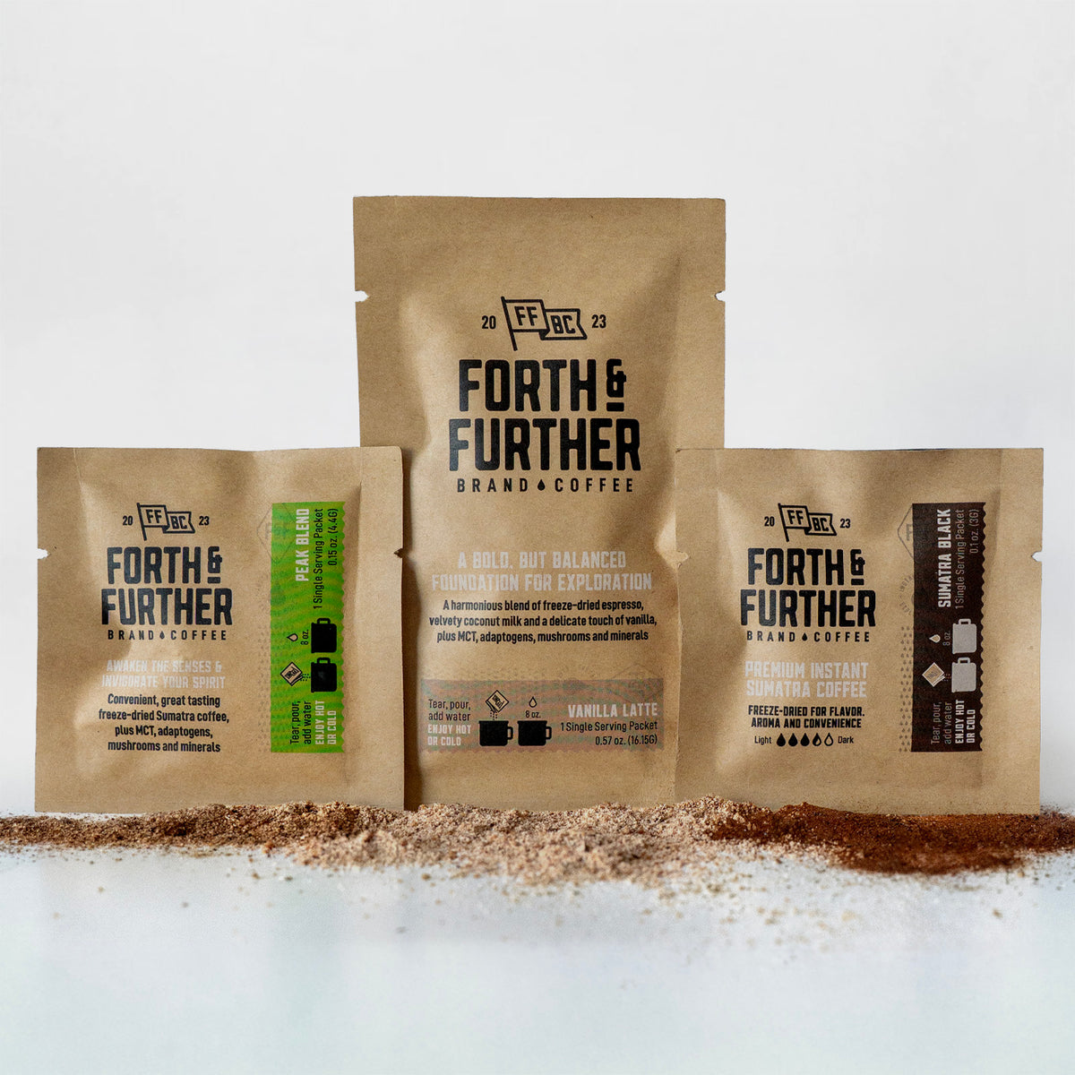 3 Forth & Further compostable coffee packages with visible freeze-dried ingredients on a white background