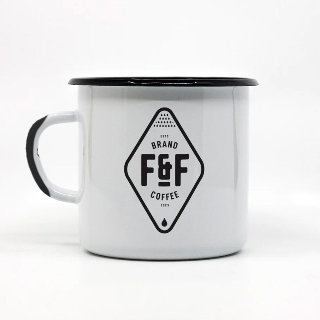 White enamel camp mug with black rim and F&F Brand Coffee logo on a white background